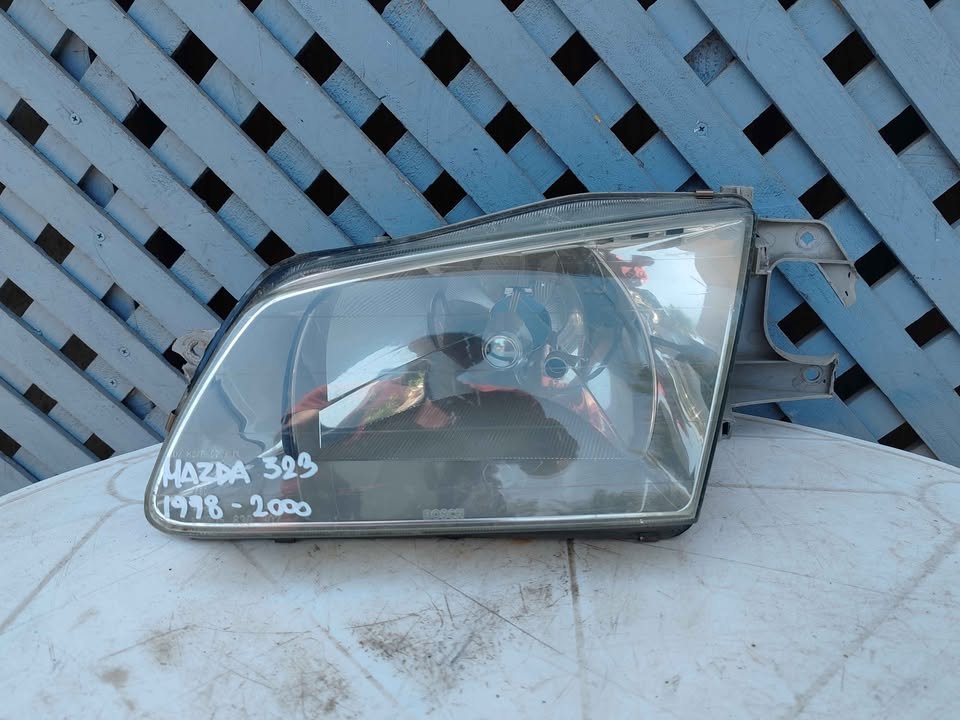 Óptico izquierdo Mazda 323 1998 - 2000
